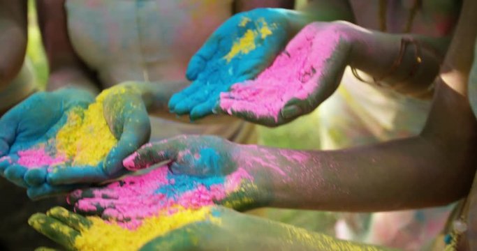 Group shot of Hands Holding Holi Powder