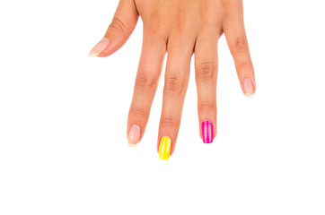 Hand with fingers spread out from above closeup nails visible in different colors pink, yellow and natural, white background