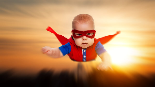 toddler little baby superman superhero with a red cape flying th
