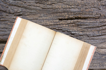 Fototapeta premium Open old book on wood