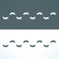 Obraz premium Man footsteps path. Footprint trail simple background