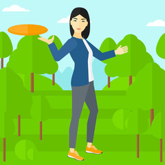 Woman playing flying disc.