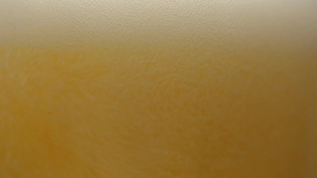 close-up beer pouring in a glass