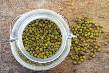Mung beans in glass jar. Selective focus to emphasize.