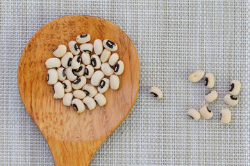 Black eye peas in wooden spoon