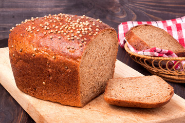 Black bread with fresh coriander closeup
