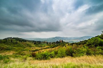 Naklejka premium village on rolling hills