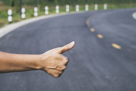 Hitchhiker Sign Thumb Up On Highway Road Outdoor