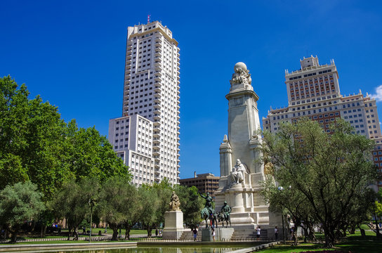 The Cervantes monument, the Tower of Madrid (Torre de Madrid) and the Spain Building (Edificio Espana) on the Square of Spain (Plaza de Espana). Madrid, Spain