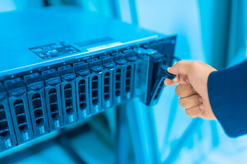 Man fix server network in data center room
