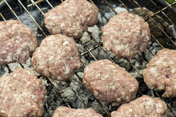 Barbecue in nature. Baking meatballs on charcoal
