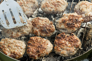 Barbecue in nature. Baking meatballs on charcoal