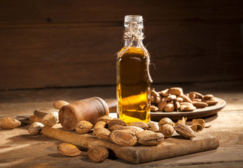 Almond oil on an old wooden background