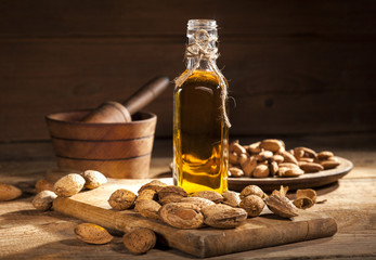 Almond oil on an old wooden background