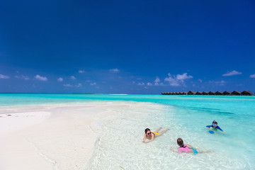 Mother and kids at tropical beach