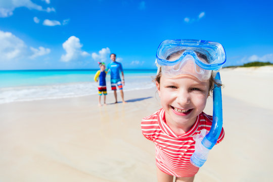 Father with kids at beach