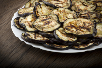 Aubergines eggplants and slices grilled on the plate