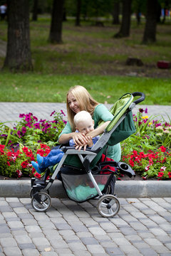 Mother with two year old son in summer park