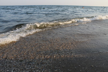 Wave of the sea on the sandy beach 