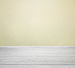 room interior with yellow concrete wall and white wood floor