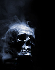 front of real skull in abstract smoke - 107653612