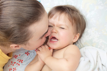 Dad kissing little daughter