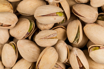 Pistachio nuts arranges as background