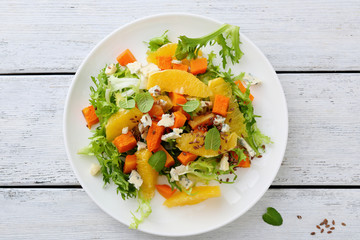 fresh salad with pumpkin and greens