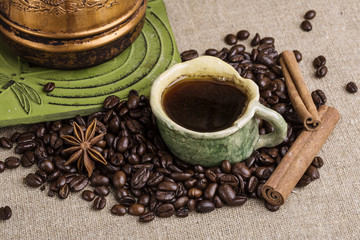 The copper cezve with coffee on the
