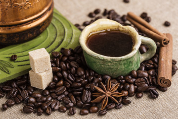 The copper cezve with coffee on the