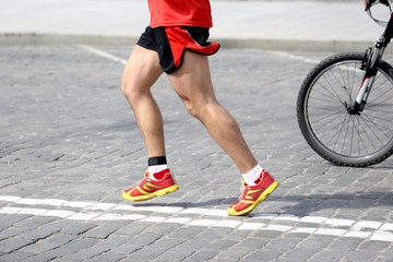 Fototapeta na wymiar feet running athlete on the course