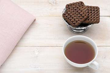 Cup of tea and chocolate cookies