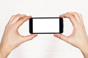 Two hands holding phone