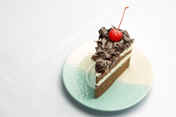 Cake is a form of sweet dessert and typically baked