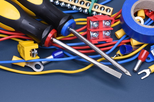 Electrical component kit to use in electrical installations on blue metal background