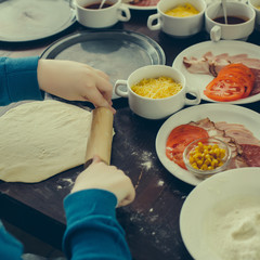 Cooking pizza with ingredients