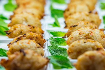 Closeup of breaded chicken nuggets