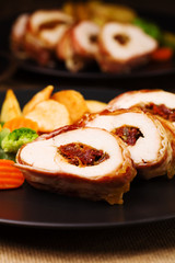 Delicious chicken rolls with dried tomatoes and mozzarella.