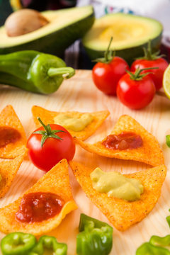 Close up of nachos chips tomato pepper and avocado