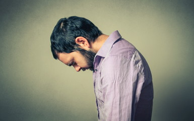 depressed and thoughtful bearded man