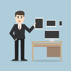 Businessman holding a tablet, smartphone, laptop