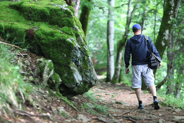 Male tourist in a spring forest