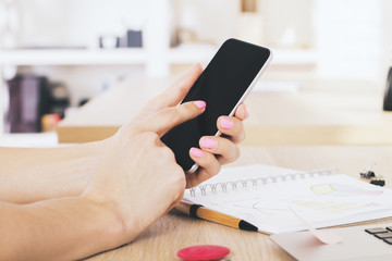 Fototapeta premium Female pointing at phone