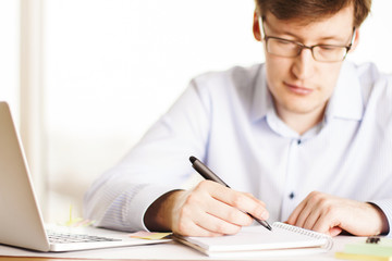 Man writing in office