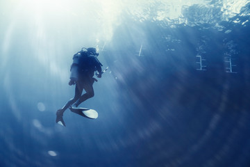 unusual photo diver underwater background