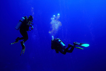 unusual photo diver underwater background