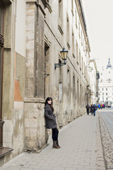 Fototapeta na wymiar Lonely girl in a gray coat