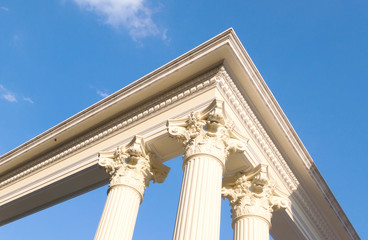 roman poles with blue sky, exterior building