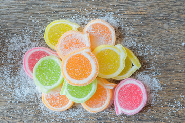 Jelly sweet, flavor fruit, candy dessert colorful on wood backgr