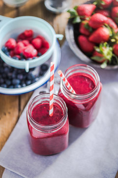 Dieting and well being concept, berry smoothie in jar